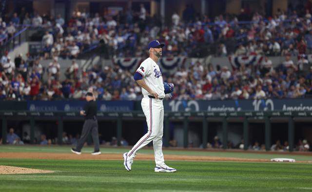 Texas Rangers pitcher Chris Martin reacts after giving up a home run to the Cincinnati Reds in the ninth inning on Friday, April 3, 2026, at Globe Life Field.